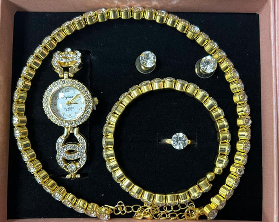 Conjunto de joyas dorado con reloj